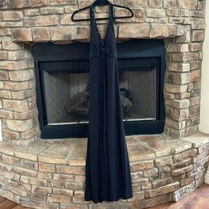 DE LARU by Sheila Yen black halter gown with front slit. Embellished top. 7/8